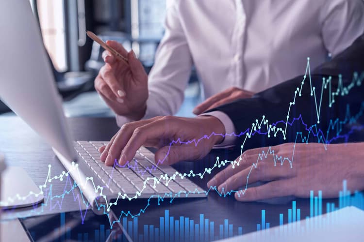Two,Traders,Man,And,Woman,Researching,Historic,Data,To,Predict